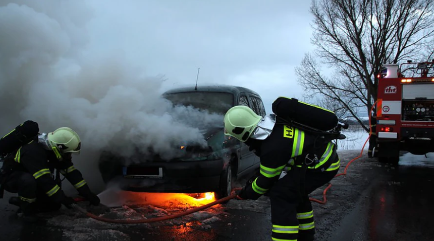 man in black helmet and black helmet standing on fire photo